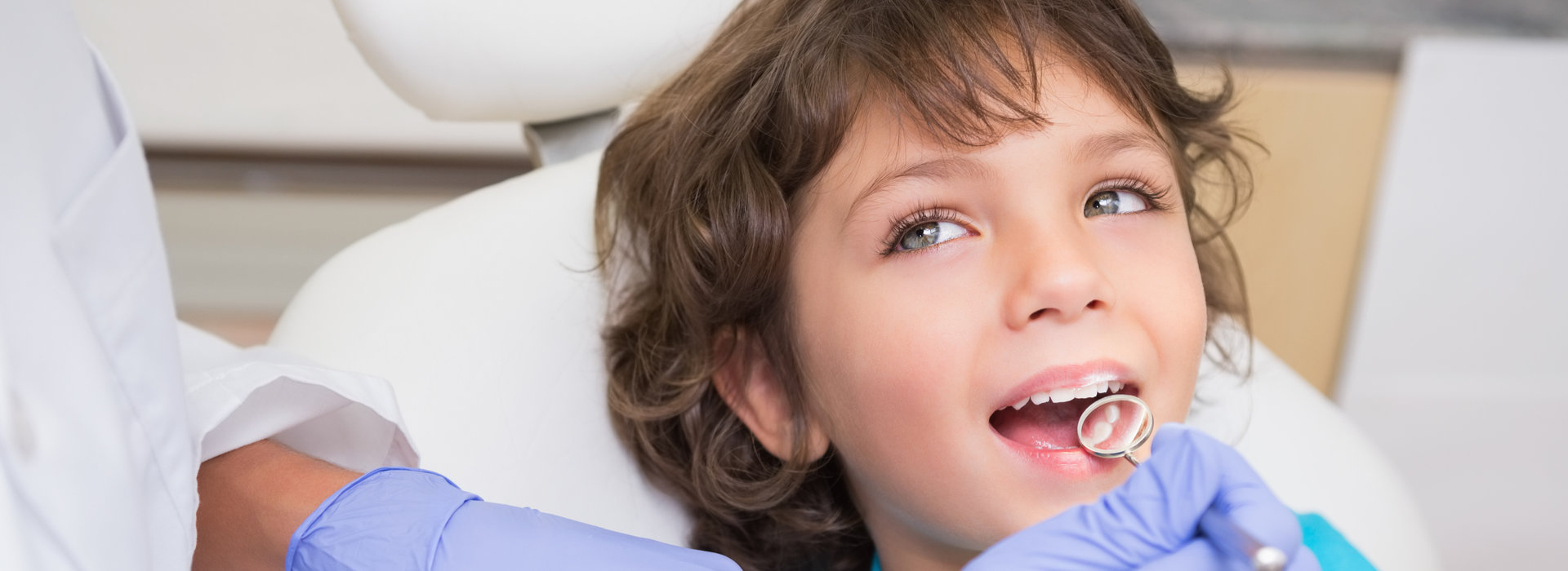 A child is smiling after Preventive Care.