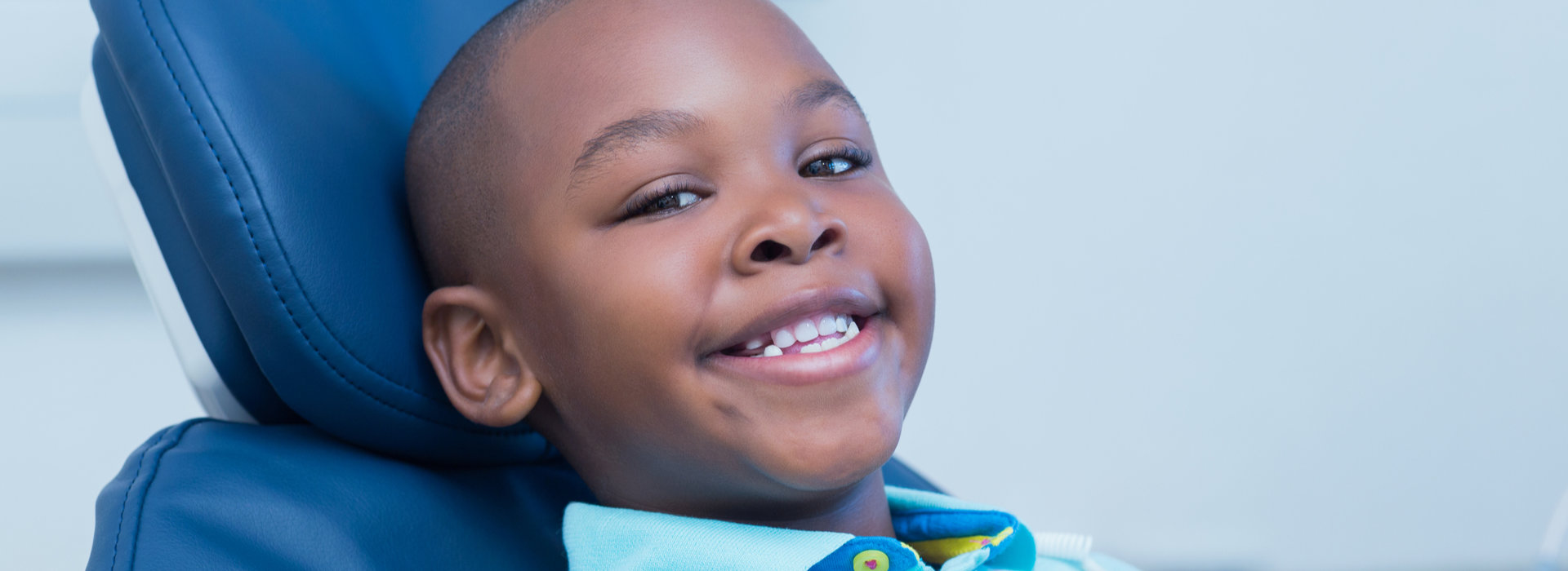 A child is smiling after Restorative Care.