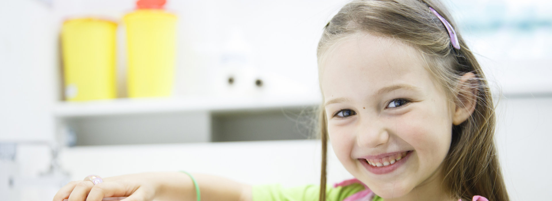 A child is smiling after Composite Dental Fillings.