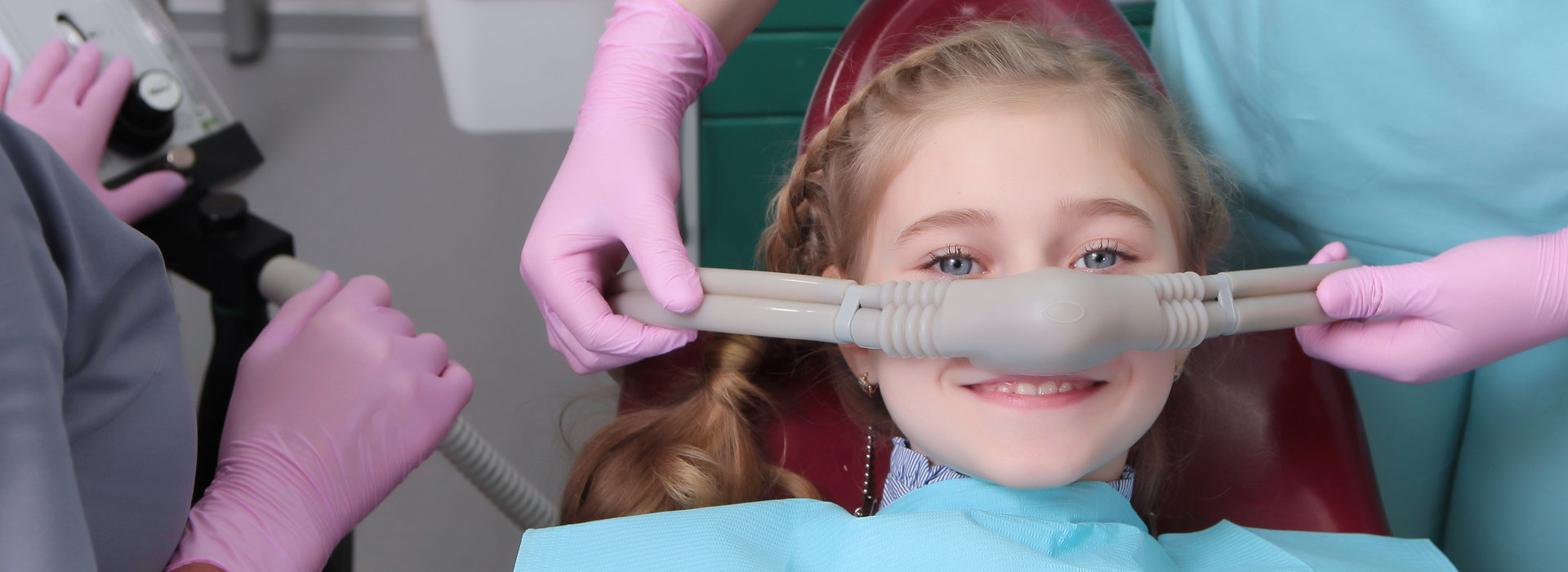 A child is smiling after Sedation Dentistry.