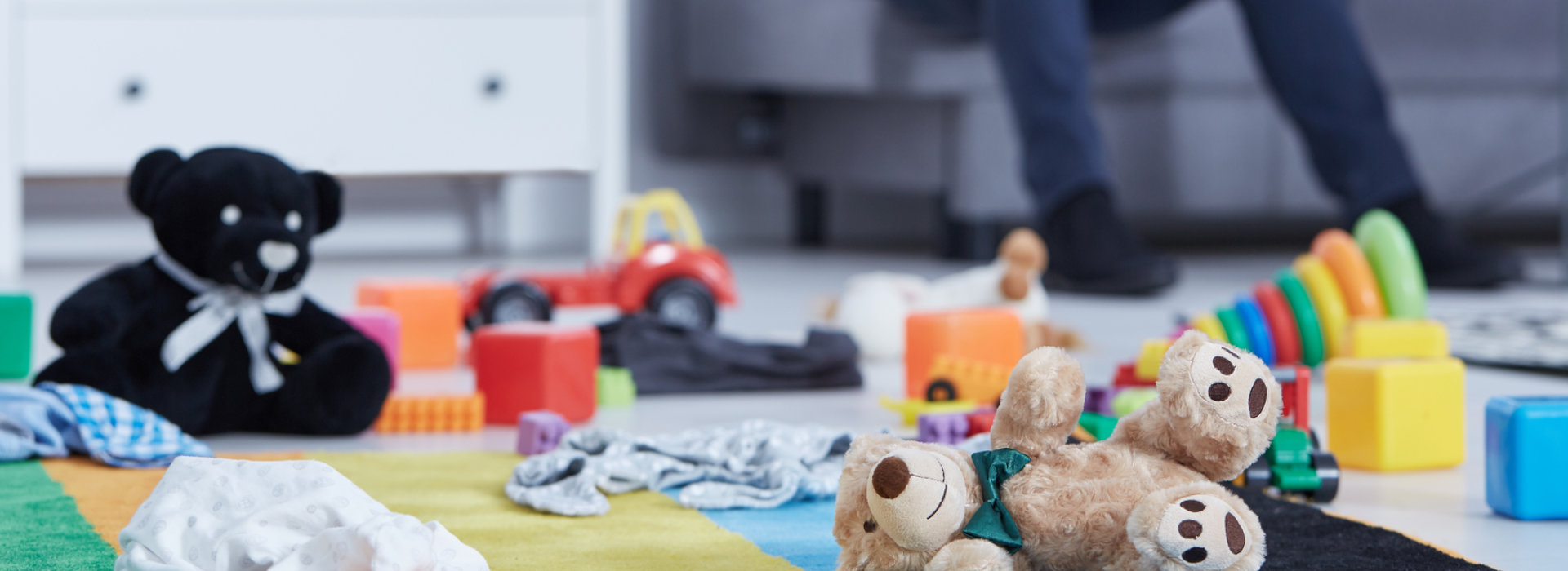 Teddy bears and toys on the floor.