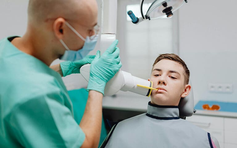 A teenager receiving a dental x-ray