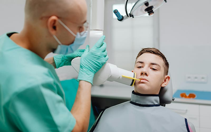 A teenager receiving a dental x-ray