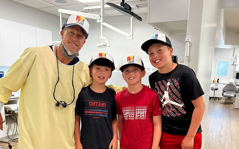Dr. John De Lorme with patients