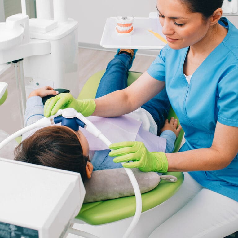 Young boy receiving anesthesia  before dental treatment